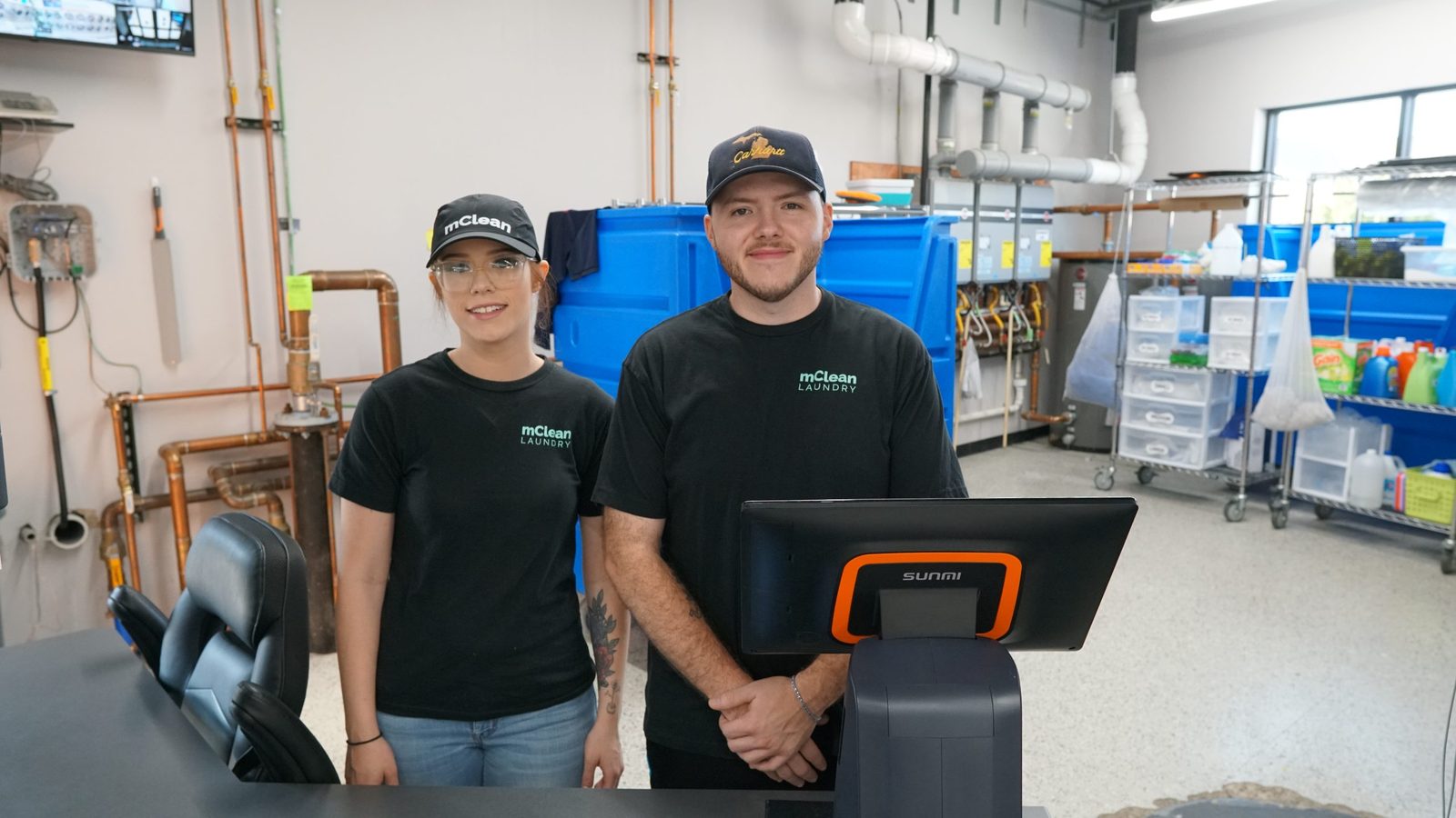 The local mClean Laundry team inside the Flat Rock store